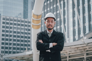 Portrait of Asian business man civil engineer concept success work with city background