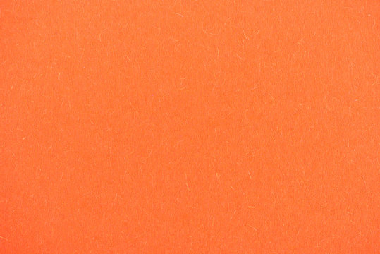 texture of bright orange paper as background