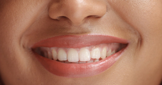 mixed race black woan's mouth closeup smiling front view