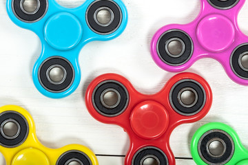 Group of spinners on wooden table