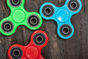 Group of spinners on wooden table