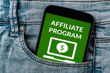 Affiliate program concept on smartphone screen in jeans pocket. All screen content is designed by...