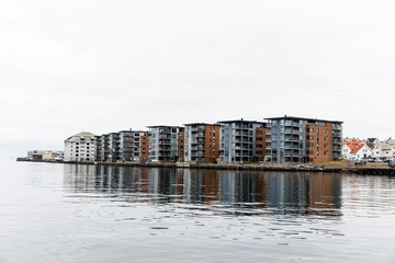 Fototapeta na wymiar Apartment buildings at Hasseloy, in the city of Haugesund, Norway