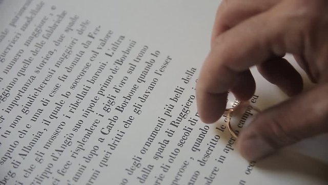 Wedding rings on the book page