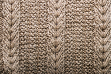 Knitted texture. Pattern fabric made of wool. Background, copy space