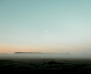 Mist over lake.The Urals landscape in the morning. The fog of dawn