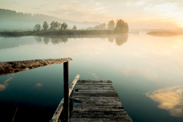 Mist over lake.The Urals landscape in the morning. The fog of dawn