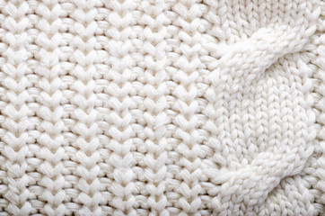 Knitted texture. Pattern fabric made of wool. Background, copy space