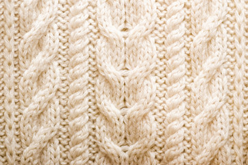 Knitted texture. Pattern fabric made of wool. Background, copy space