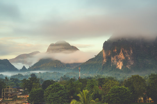 Beautiful sunrise and white mist with mountain at Vang vieng, Laos.