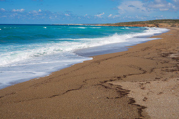 Sea waves splash around the sand beach - Cyprus