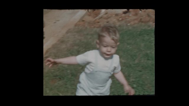 1959 Cute Blonde Baby boy running up and down hill next to antique vintage cars