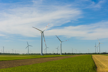 Wind turbines with blue sky.