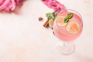 Pink cocktail with fig