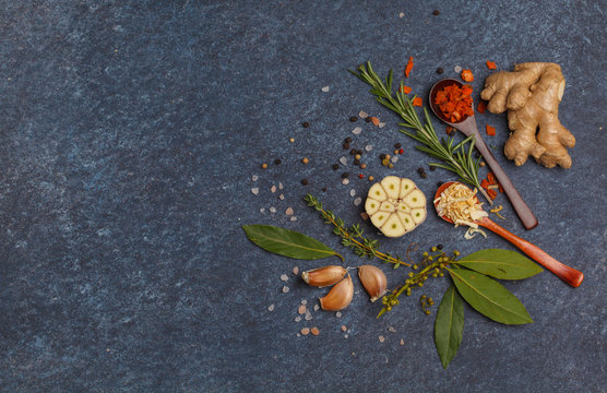 Selection of spices, vegetables, herbs and greens. Ingredients for cooking soup. Dark background, top view, copy space.