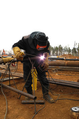 Welder at construction site