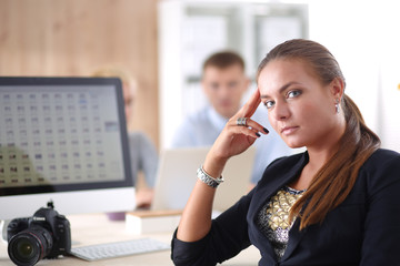 Portrait of an attractive young businesswoman sitting in front of a computer.businesswoman .