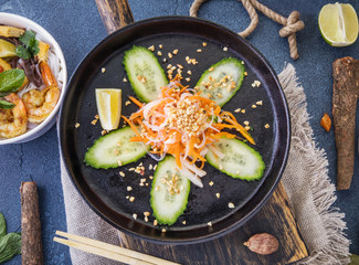 Asian food with noodles, beef and vegetables.