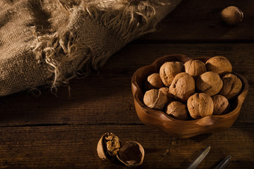 Dried walnuts on a rustic wooden table