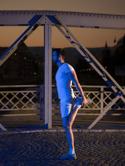 man jogging across the bridge in the city