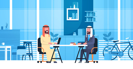 Arabic Business Men Sitting At Office Desk In Modern Coworking Space Working Together Muslim Workers In Coworkers Center Flat Vector Illustration