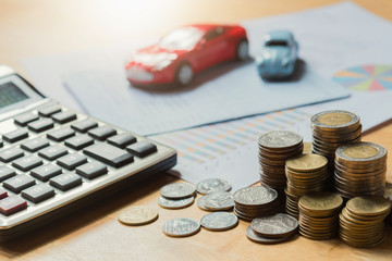 Toy car with calculator and money. concept business finance and insurance