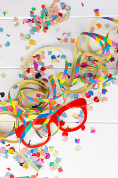 carnival party background with confetti, streamer and mask