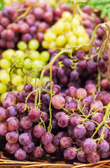 Grapes background. Organic Ripe red and white grape   at  market. Harvesting concept. Grape in a local market