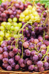 Grapes background. Organic Ripe red and white grape   at  market. Harvesting concept. Grape in a...