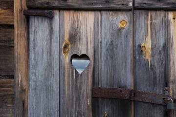 The wooden door with heart. Background