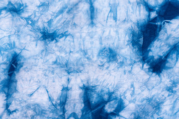 Pattern of blue dye on cotton cloth, Dyed indigo fabric background and textured