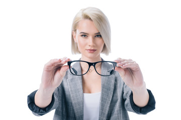 beautiful blonde woman holding eyeglasses, isolated on white