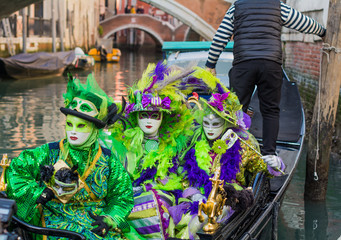 Venice, Italy, February 6, 2016 : couple in mask and costume at the carnival in Venice. The Carnival of Venice is an annual festival, world famous for its elaborate masks.
