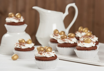 Easter Cupcakes Decorated With Golden Chocolate Eggs. Home Baked.