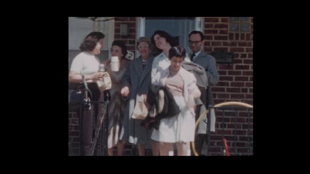 1959 Family leaving house to go on trip