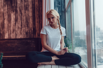 Beautiful girl with two braids in a white T-shirt. Mock-up.