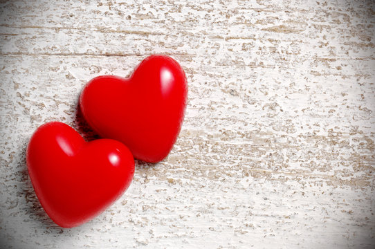 two hearts on white wood