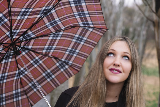 beautiful young woman with umbrella