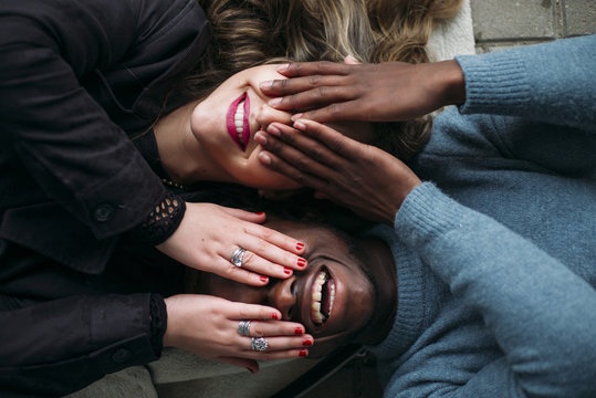 Deep Connection Between Two Young People Of Different Races. They Cover Your Eyes