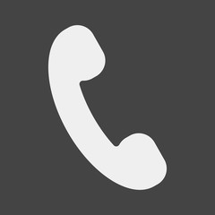 Handset vector icon. Phone icon in flat style on grey background