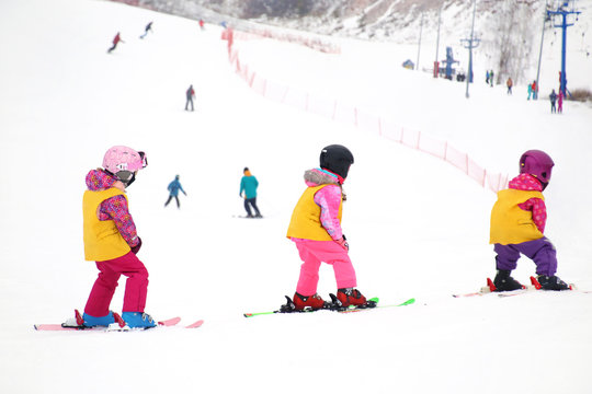 little kids skiing in ski resort