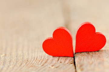 Hearts on a wooden background. Background in the style of Valentine's Day. Heart on a wooden background
