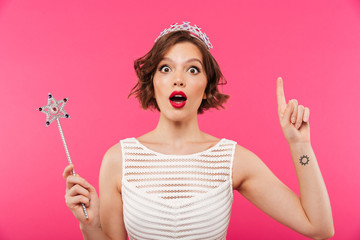 Portrait of an excited girl wearing crown - obrazy, fototapety, plakaty