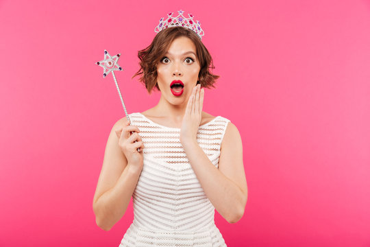 Portrait of a shocked girl wearing crown