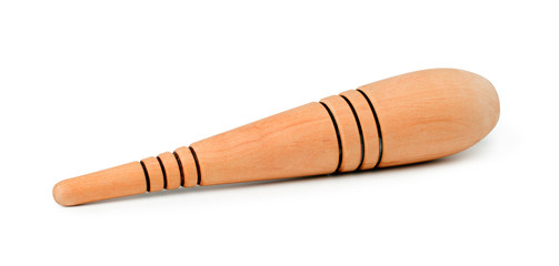 Wooden massage stick isolated on white background. Reflexology foot massage.