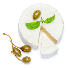 Round brie or camambert cheese on a white background