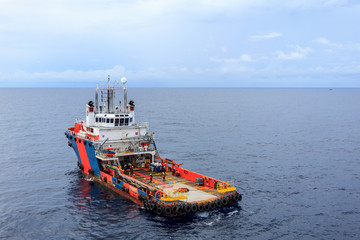 GULF OF THAILAND,SEPTEMBER 30,2017: Offshore oil and gas supply boat approach to the platform for transfer passenger between supply boat and platform.