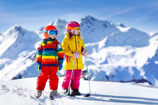 Ski and snow winter fun for kids. Children skiing.