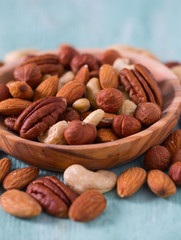 mixed nuts on wooden surface