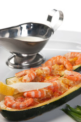 Cucumber stuffed shrimps isolated on a white